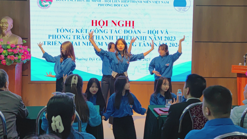 A group of young girls in blue shirts

Description automatically generated